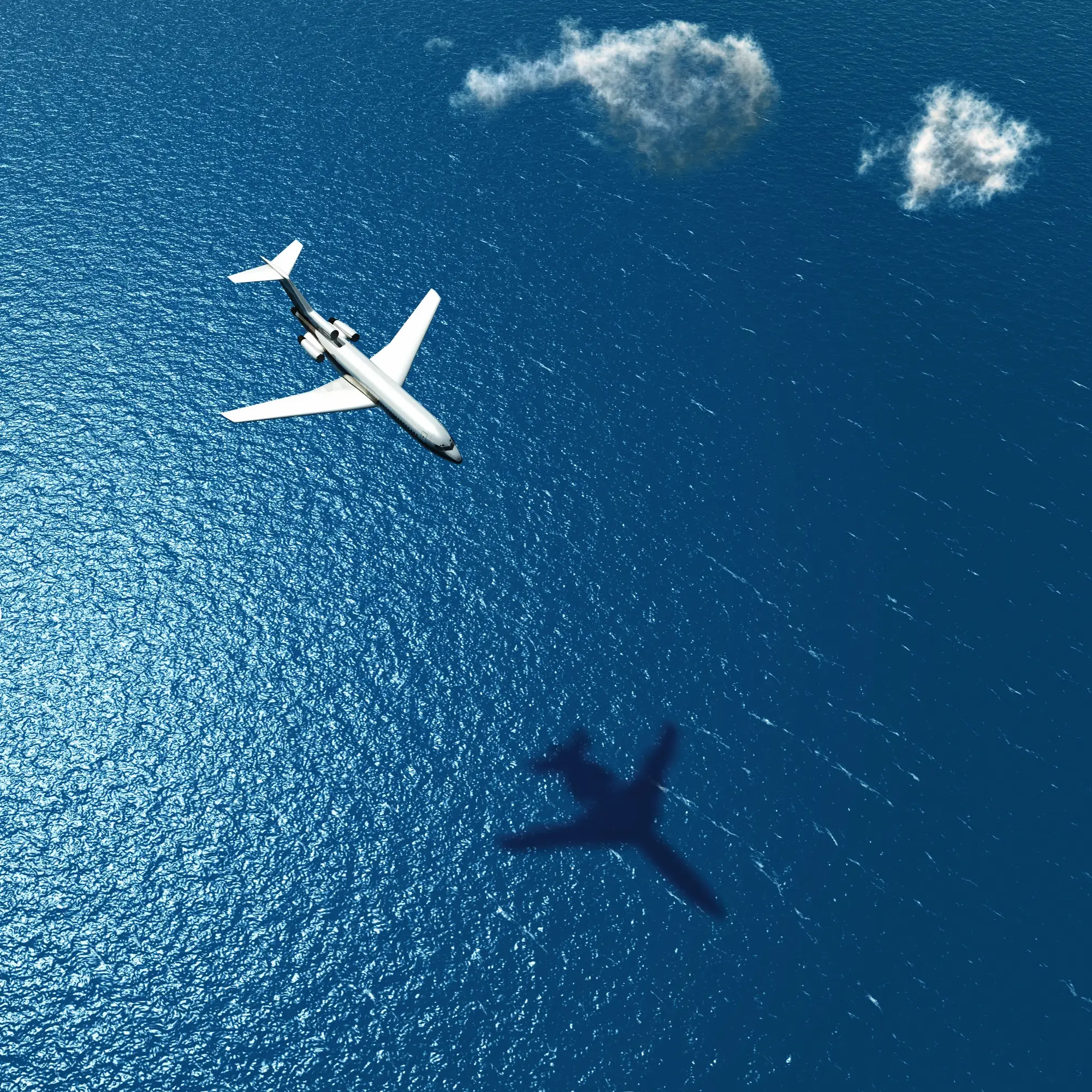 travel plane flying over sea